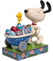 snoopy with a wagon of easter eggs